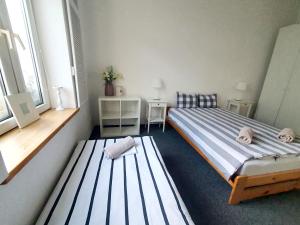 Posteľ alebo postele v izbe v ubytovaní Master Corner Apartment