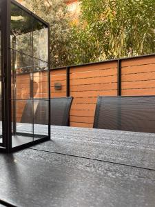 a table with a glass case on top of it at GatheringThess- The backyard in Thessaloniki