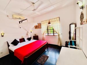 Rúm í herbergi á Mali Guest House