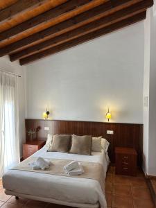 Postel nebo postele na pokoji v ubytování Hostal Camarina