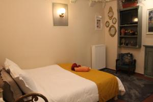 a bedroom with a bed with a teddy bear on it at Arachova Boka's House, Elegant Apartment in Arachova