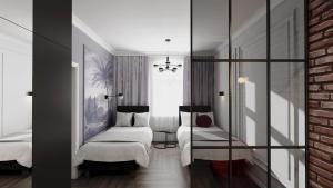 a bedroom with two beds and a brick wall at Deco Apartments Mariacka 8 - apartamenty w centrum Katowic in Katowice