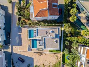 an overhead view of a house with a swimming pool at Villa Nova Excellence 1, villa with private pool in Novalja +91 photos