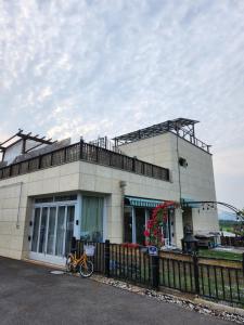a building with a bike parked in front of it at Kong's heyri pet-friendly in Paju