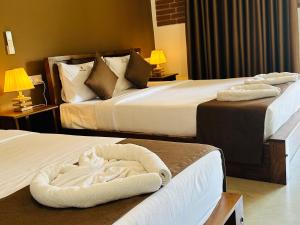 Postelja oz. postelje v sobi nastanitve Hotel Heladiv