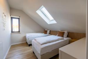Ένα ή περισσότερα κρεβάτια σε δωμάτιο στο Huswell - Family stay with Garden & Sauna