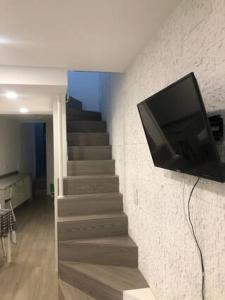 TV a/nebo společenská místnost v ubytování Cantinho do Mercado