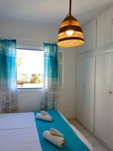 Cama ou camas em um quarto em Maria's Kouka Pension