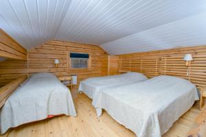 Postel nebo postele na pokoji v ubytování Lentiira Holiday Village