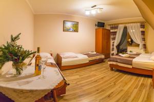 Posteľ alebo postele v izbe v ubytovaní Domek Deluxe Resort Willa Adrian
