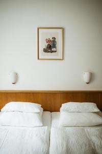 A bed or beds in a room at Pension Baranekhof - accommodation in nature - Baranek Resorts