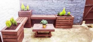 a patio with two benches and a table with plants at Moonlight Residence - Anfield Stadium, Free Parking & Free WiFi in Liverpool