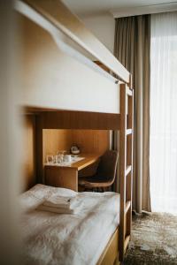 A bed or beds in a room at Pension Baranekhof - accommodation in nature - Baranek Resorts
