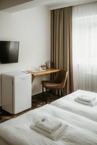 A bed or beds in a room at Pension Baranekhof - accommodation in nature - Baranek Resorts