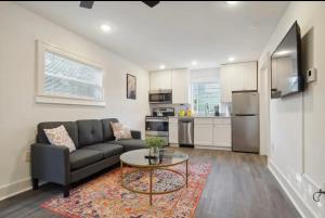a living room with a couch and a table at Cute 1bed 1bath walk to French Q and Bourbon St in New Orleans