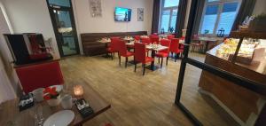 TV a/nebo společenská místnost v ubytování Hotel Astor