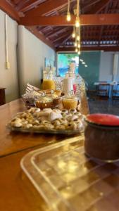 a table with a tray of food on a table at Pousada Villa Carolina in Carolina +10 photos