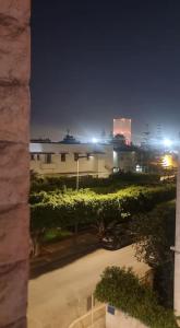 a view of a building at night with lights at Spacious and Modern 2BR Apartment Rabat center in Rabat
