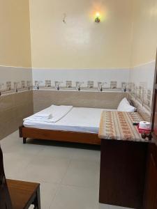 Postel nebo postele na pokoji v ubytování Thanh Tâm Hotel