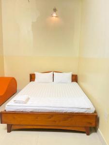 Postel nebo postele na pokoji v ubytování Thanh Tâm Hotel