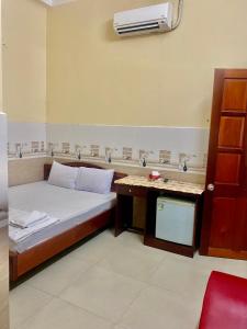 Postel nebo postele na pokoji v ubytování Thanh Tâm Hotel