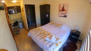 Postel nebo postele na pokoji v ubytování APART HOTEL EN BULNES