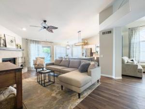a living room with a couch and a chair at Val Vista Oasis- Gorgeous Gilbert Home with Pool in Gilbert
