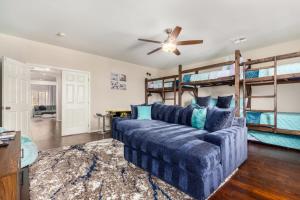 a living room with a couch and bunk beds at The Grand Saguaro Amazing Gilbert Home in Gilbert +92 photos