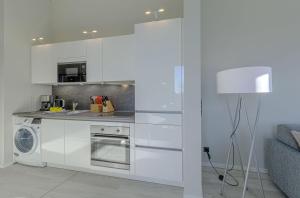 Dapur atau dapur kecil di Käptenslounge - Ferienapartment für vier Personen mit Westbalkon und komfortabler Ausstattung