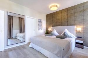 Ένα ή περισσότερα κρεβάτια σε δωμάτιο στο First Garden View - Ihre Ferienwohnung im Ostseebad Wustrow