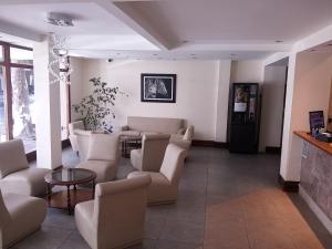 a waiting room with couches and a table at Hotel Europa in Mar del Plata