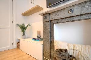 an old barn door in a living room at - Le Cocoune - Cosy & Cute Flat in Liège