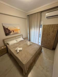 Katil atau katil-katil dalam bilik di Samaras luxurious apartment