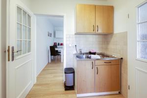 a kitchen with a sink and a counter top at Landlüttje mit Terrasse in Alt Schwerin