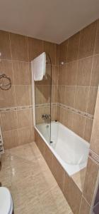 a bathroom with a bath tub and a toilet at La Palma de Cabrales - AT-1501-AS in Arenas de Cabrales +53 photos