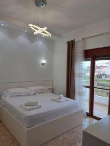 A bed or beds in a room at Olmar's Guest House