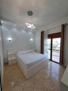 A bed or beds in a room at Olmar's Guest House