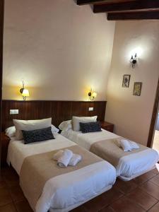 Postel nebo postele na pokoji v ubytování Hostal Camarina