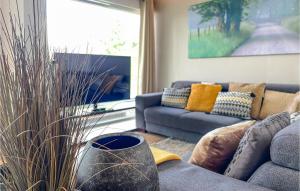 a living room with a couch and a large window at Beautiful Home In Bocholt With Wifi in Bocholt