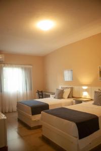 Postel nebo postele na pokoji v ubytování Matiz Igaratá Resort, Spa e Eventos