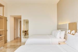 Postel nebo postele na pokoji v ubytování Fiesta Inn Veracruz Boca Del Rio