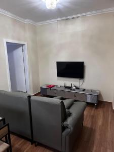 TV a/nebo společenská místnost v ubytování Aconchego da Mutamba