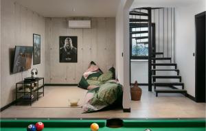 a living room with a couch and a pool table at Villa The View in Sveta Marina