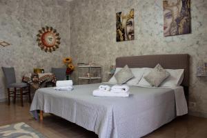 Ένα ή περισσότερα κρεβάτια σε δωμάτιο στο La Maison Sicula