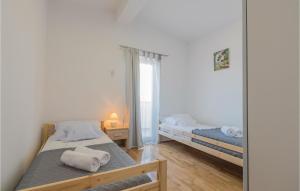 Posteľ alebo postele v izbe v ubytovaní Three-Bedroom Holiday Home In Grubine