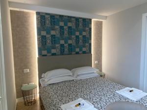 Letto o letti in una camera di B&B Suite Cutelli