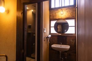 a bathroom with a sink and a mirror at quolo - Vacation STAY 88953v in Tamba-sasayama