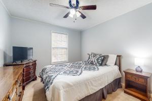 a bedroom with a bed and a ceiling fan at Magnificent Views in Murphy in Murphy