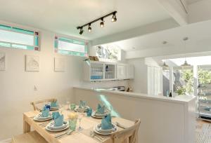 a kitchen and dining room with a table and chairs at 3943 Rad Beach House home in Pacific Grove
