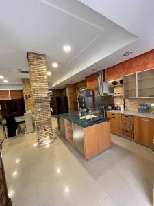 a large kitchen with a island in a room at IY Loft 5 - Spacious Loft in the Old Town in Valencia +9 photos